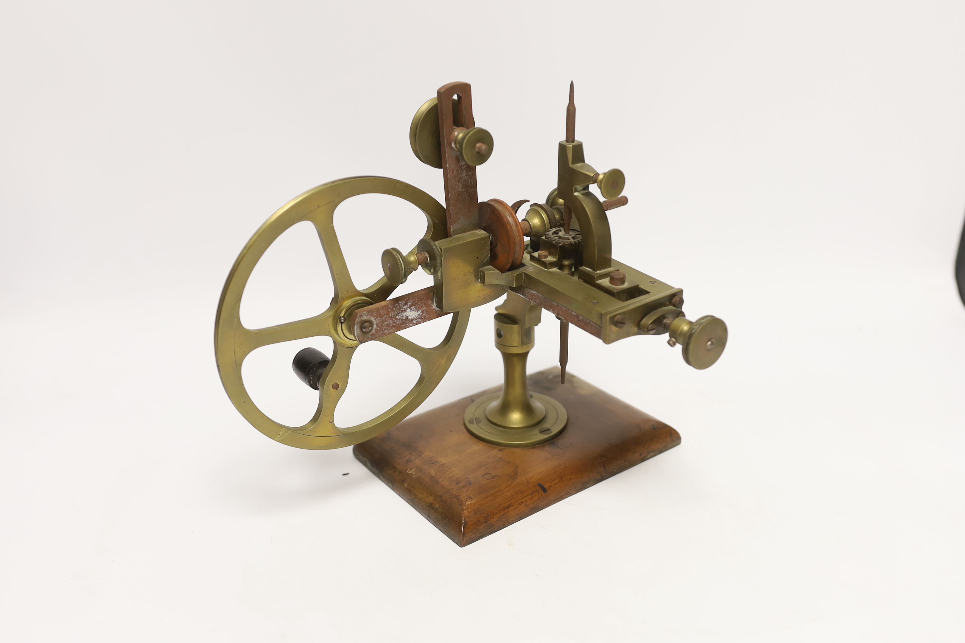 An early 20th century watchmaker's topping tool, for adapting the profile of teeth on watch wheels, 23cm high